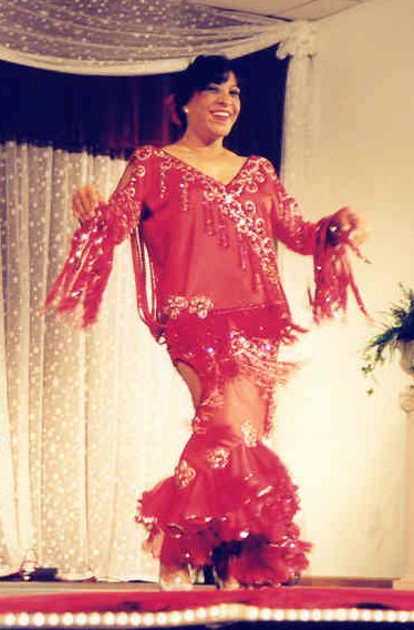 Amaya performs in red costume