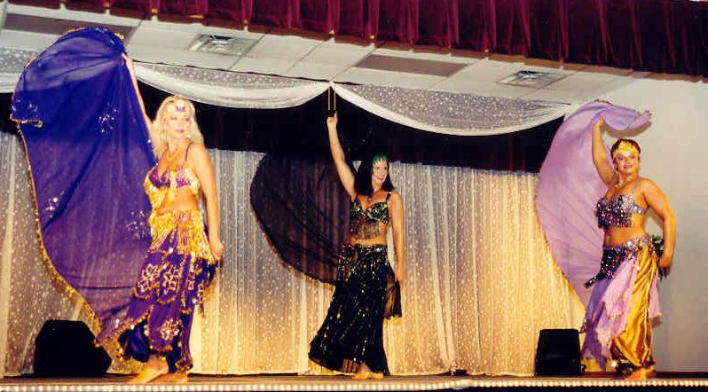 3 dancers perform veil choreography