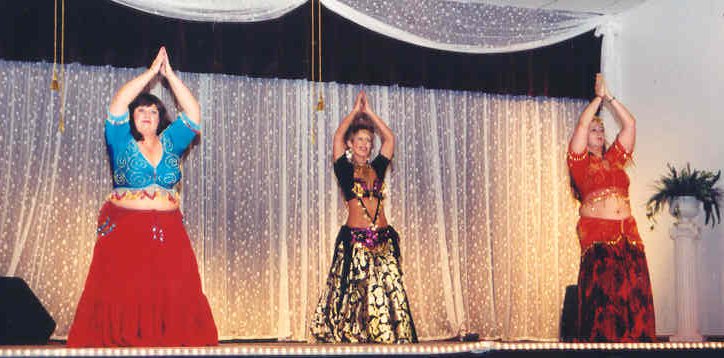 group of 3 dancers on stage