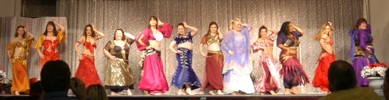 group of dancers perform on stage