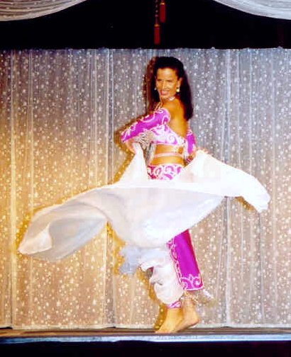 dancer wearing bright pink with white veil