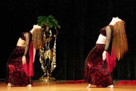 2 dancers in red and black doing backbends