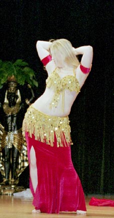 dancer Jewel performs in dark pink velvet with gold bedlah