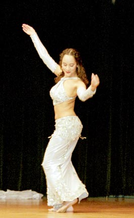 dancer Marjan performs in silver and white