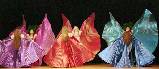 6 dancers with wings perform on stage