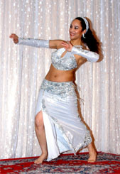 dancer in silver-white performs on stage