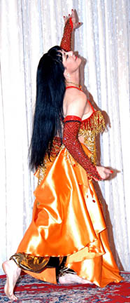 dancer with dark hair in orange