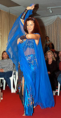 dancer performs with a blue veil