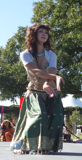 dancer wearing green and white performs on stage